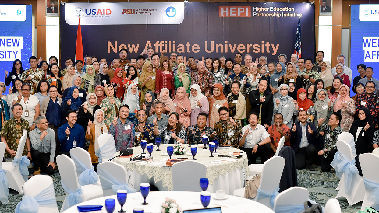 group of people in front of event banners