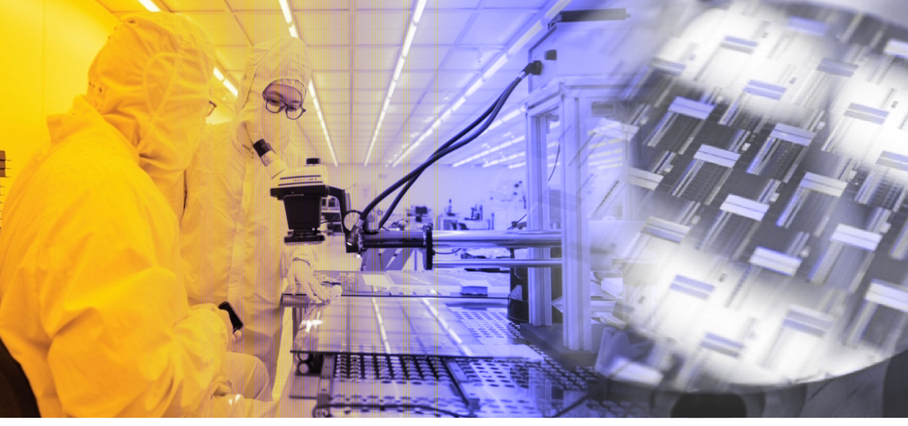 Two people working inside a clean room.